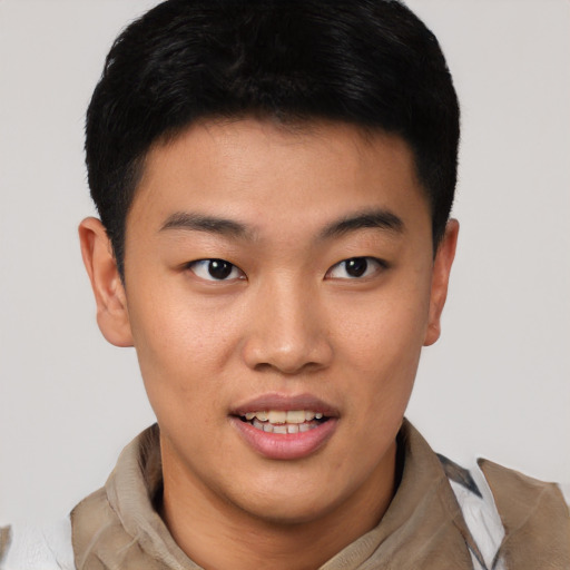 Joyful asian young-adult male with short  brown hair and brown eyes