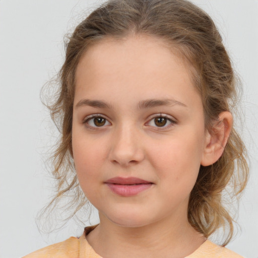 Joyful white child female with medium  brown hair and brown eyes