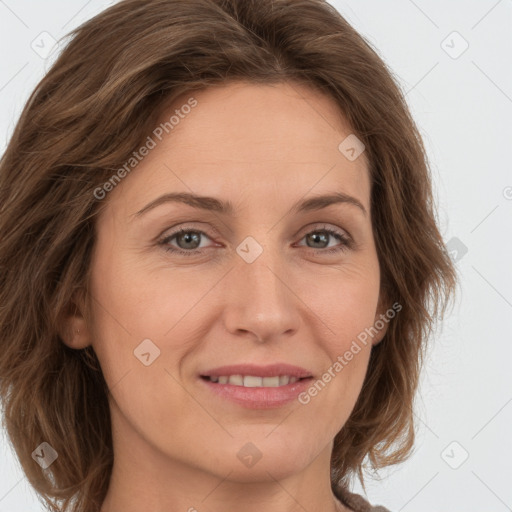 Joyful white young-adult female with long  brown hair and green eyes