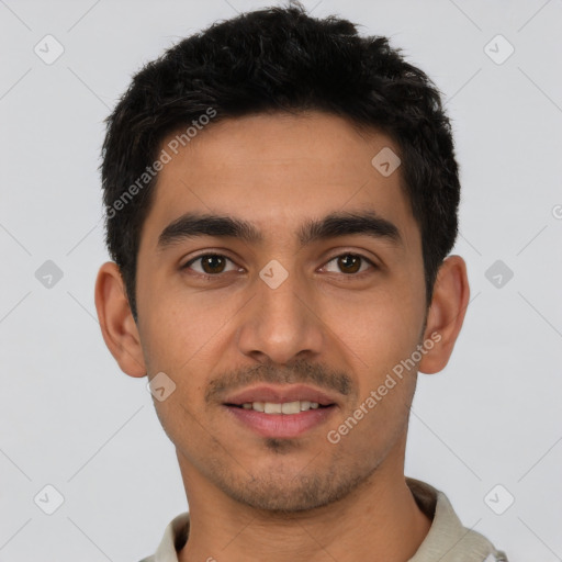 Joyful latino young-adult male with short  black hair and brown eyes