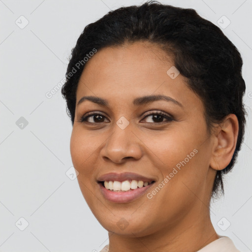 Joyful latino young-adult female with short  brown hair and brown eyes