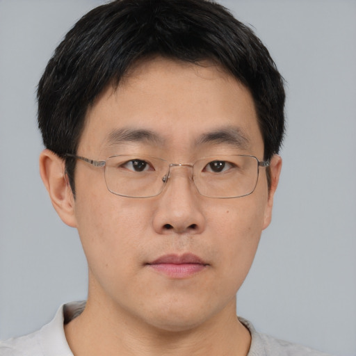 Neutral asian young-adult male with short  brown hair and brown eyes