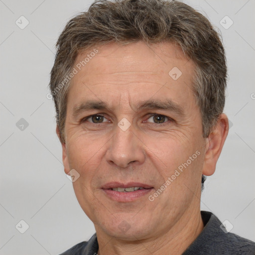 Joyful white middle-aged male with short  brown hair and brown eyes