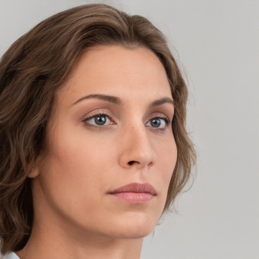 Neutral white young-adult female with medium  brown hair and grey eyes