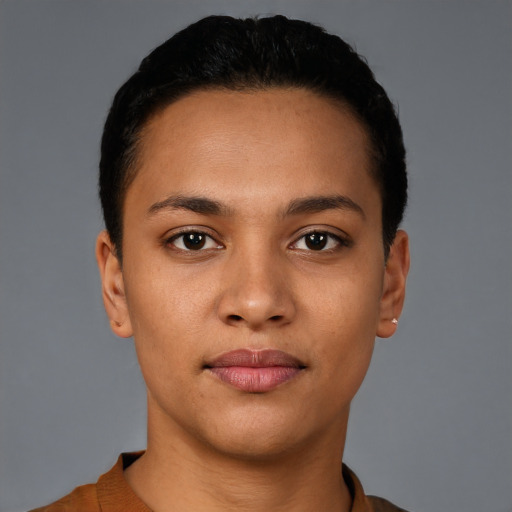 Joyful latino young-adult female with short  black hair and brown eyes