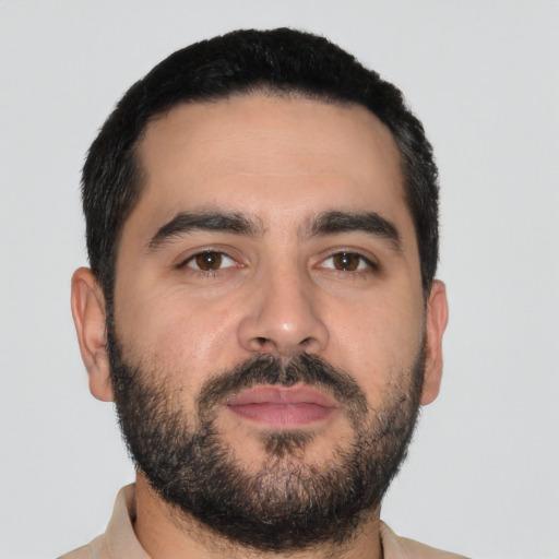 Neutral latino young-adult male with short  black hair and brown eyes