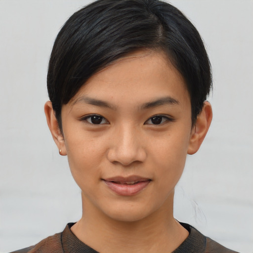 Joyful asian young-adult female with short  black hair and brown eyes