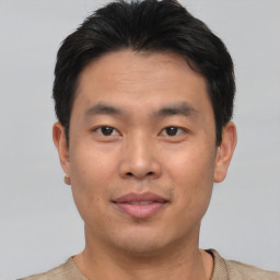 Neutral asian young-adult male with short  brown hair and brown eyes