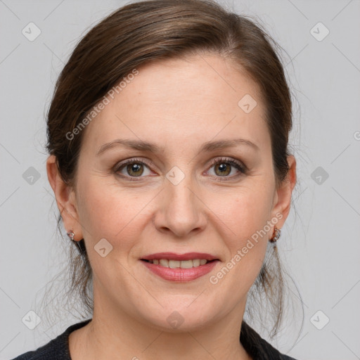 Joyful white adult female with medium  brown hair and grey eyes