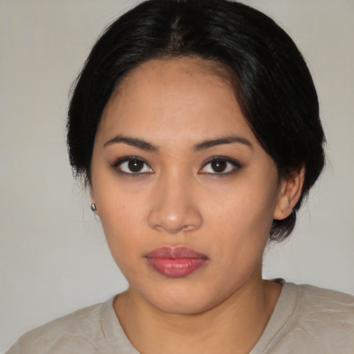 Neutral latino young-adult female with medium  black hair and brown eyes