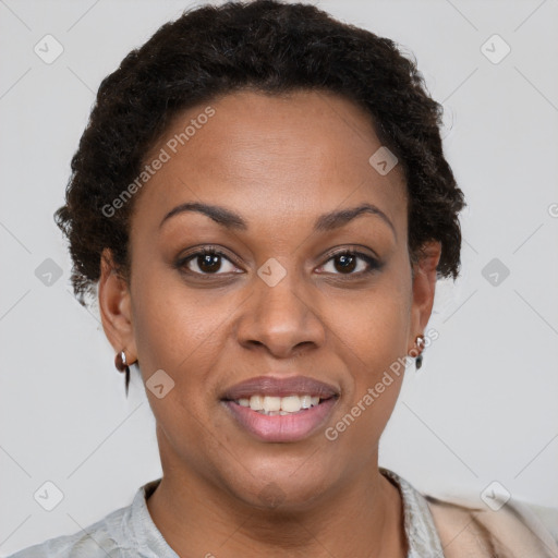 Joyful black young-adult female with short  brown hair and brown eyes