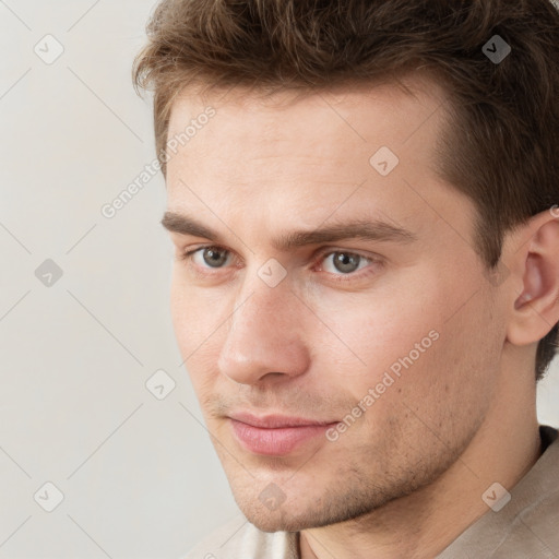 Neutral white young-adult male with short  brown hair and grey eyes