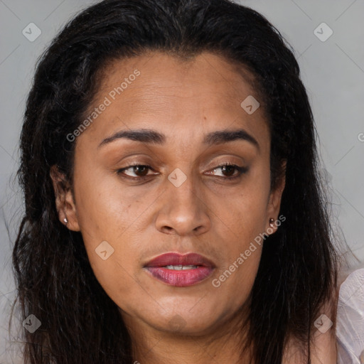 Joyful latino young-adult female with long  brown hair and brown eyes