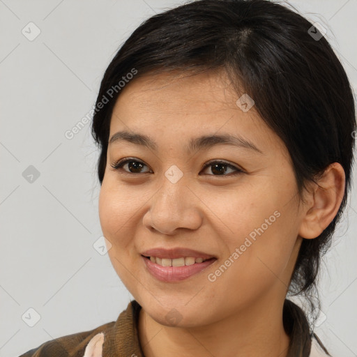 Joyful asian young-adult female with medium  brown hair and brown eyes