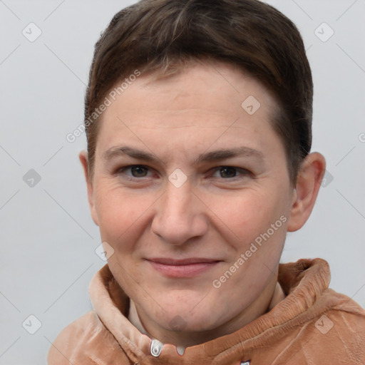 Joyful white young-adult female with short  brown hair and grey eyes