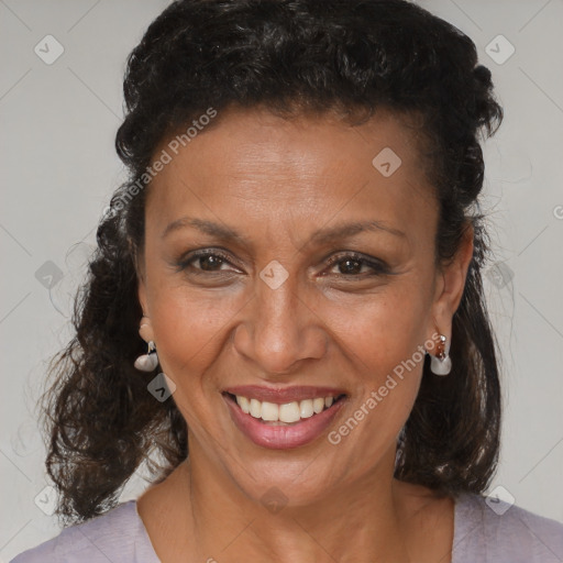 Joyful black adult female with medium  brown hair and brown eyes