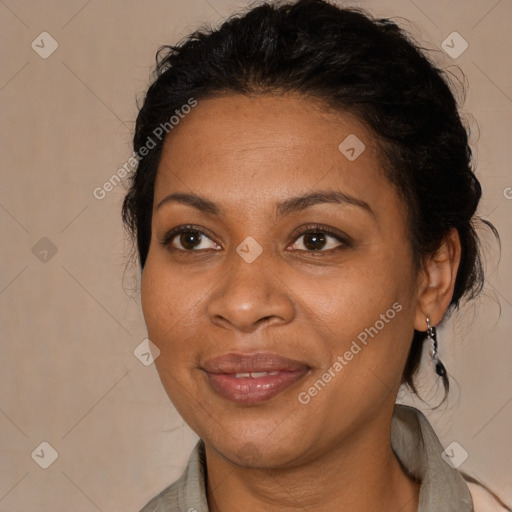 Joyful black adult female with medium  brown hair and brown eyes