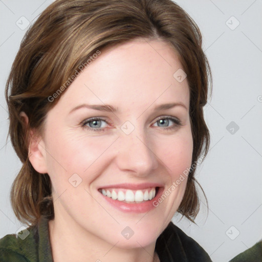 Joyful white young-adult female with medium  brown hair and blue eyes