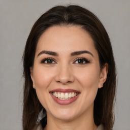 Joyful white young-adult female with medium  brown hair and brown eyes