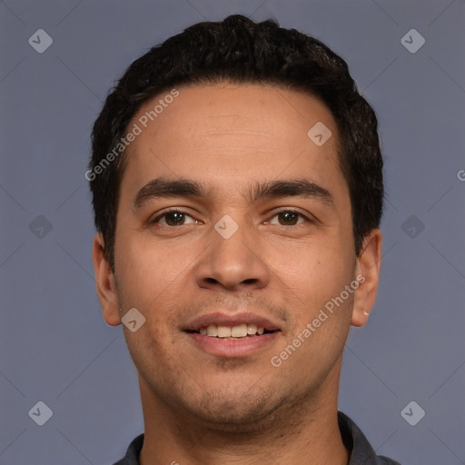 Joyful white young-adult male with short  black hair and brown eyes