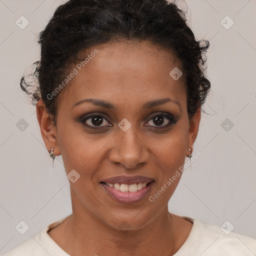 Joyful black young-adult female with short  brown hair and brown eyes