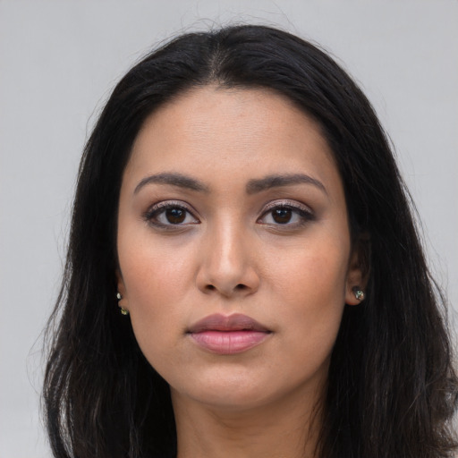 Neutral latino young-adult female with long  black hair and brown eyes