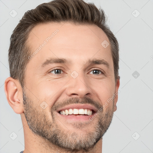 Joyful white adult male with short  brown hair and brown eyes