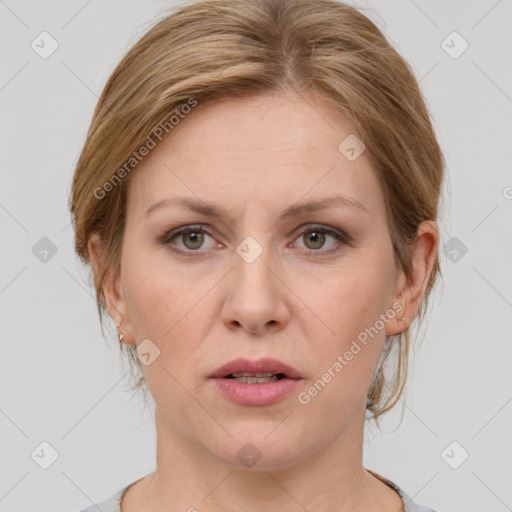 Joyful white adult female with medium  brown hair and grey eyes