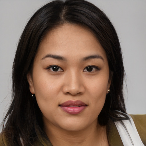 Joyful asian young-adult female with medium  brown hair and brown eyes