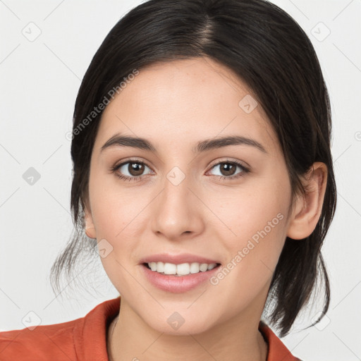 Joyful white young-adult female with medium  brown hair and brown eyes