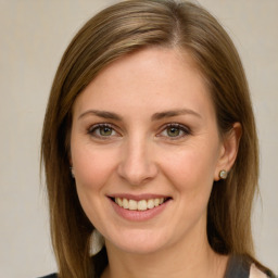 Joyful white young-adult female with medium  brown hair and green eyes