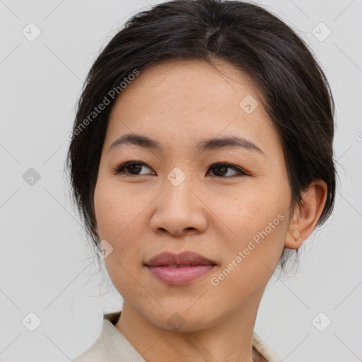 Joyful asian young-adult female with medium  brown hair and brown eyes