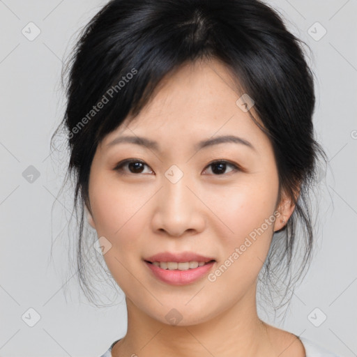 Joyful asian young-adult female with medium  black hair and brown eyes