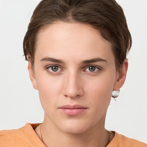 Neutral white young-adult female with medium  brown hair and brown eyes