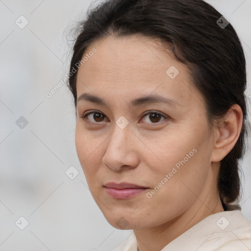 Joyful white adult female with medium  brown hair and brown eyes