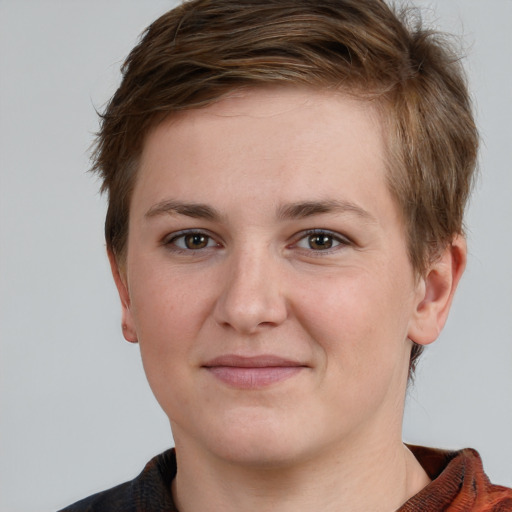 Joyful white young-adult female with short  brown hair and grey eyes