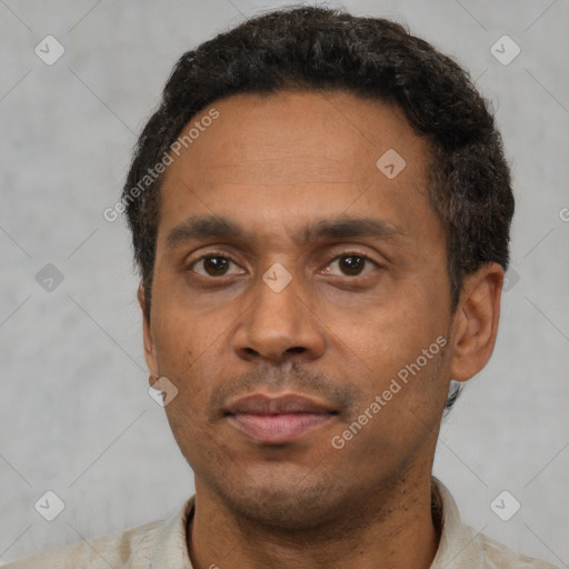 Neutral latino adult male with short  black hair and brown eyes