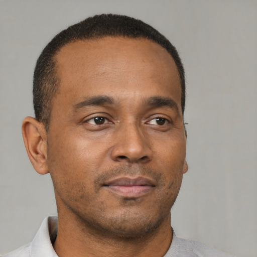 Neutral black young-adult male with short  brown hair and brown eyes