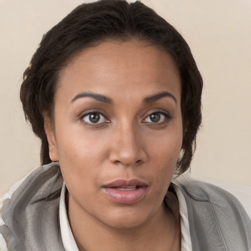 Neutral white young-adult female with short  brown hair and brown eyes