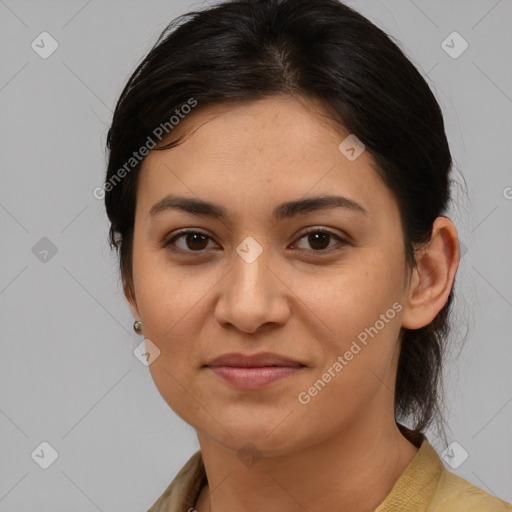 Joyful latino young-adult female with medium  brown hair and brown eyes