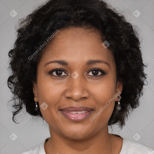 Joyful black adult female with medium  brown hair and brown eyes