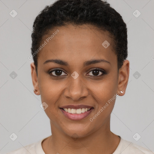 Joyful black young-adult female with short  black hair and brown eyes