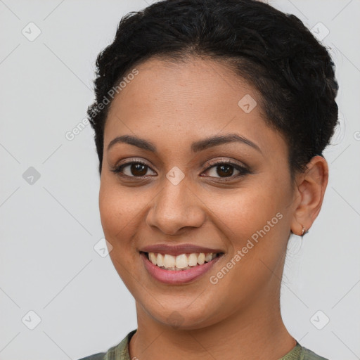 Joyful latino young-adult female with short  brown hair and brown eyes