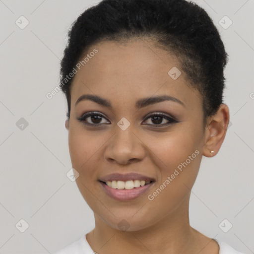 Joyful latino young-adult female with short  black hair and brown eyes