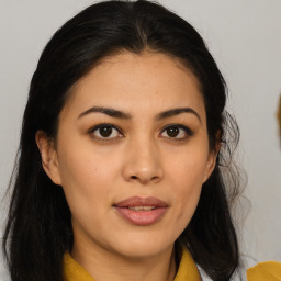 Joyful asian young-adult female with long  brown hair and brown eyes