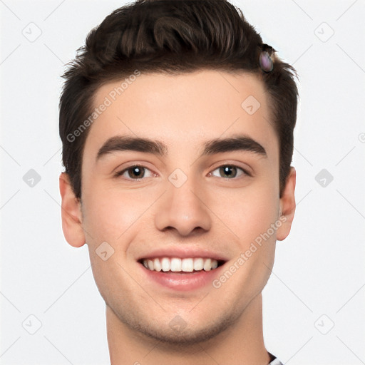 Joyful white young-adult male with short  black hair and brown eyes