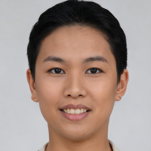 Joyful asian young-adult female with short  brown hair and brown eyes