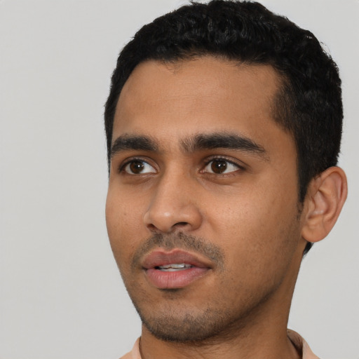 Neutral latino young-adult male with short  black hair and brown eyes