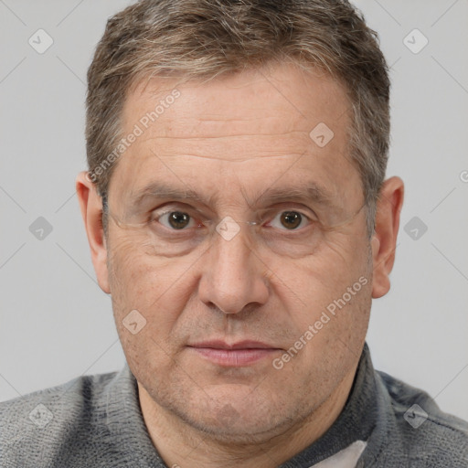 Joyful white middle-aged male with short  brown hair and brown eyes