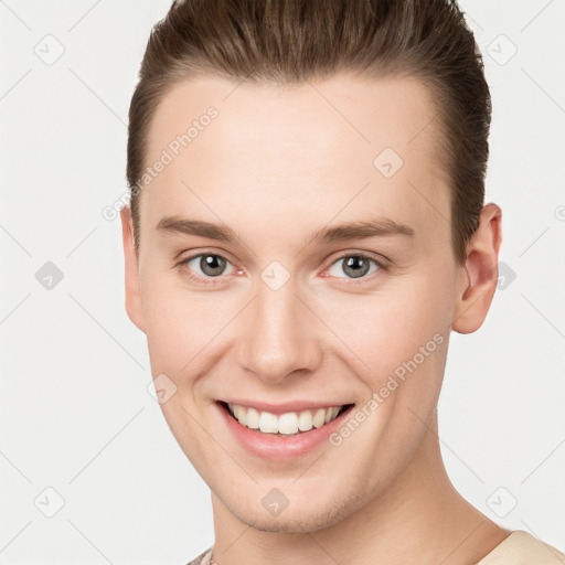 Joyful white young-adult female with short  brown hair and grey eyes